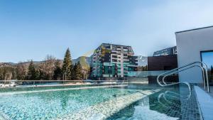 a swimming pool on the roof of a building at Luxury Penthouse-Poiana Brasov in Poiana Brasov