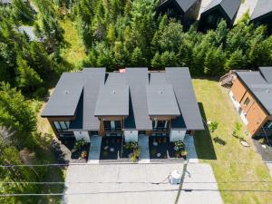 an overhead view of a house with a roof at Agora Trio Portneuf - 3 Family Units - Spa & Nature in Pont-Rouge
