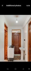 a bathroom with a bath tub and a sink at 2bedroom house along waiyaki way in Nairobi