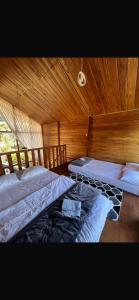 En eller flere senge i et værelse på Cabin Hillside Dieng + 30 billeder