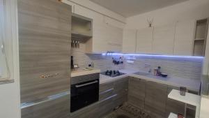 a kitchen with a sink and a stove top oven at GS Valtellina in Morbegno