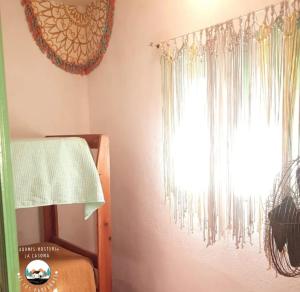 En eller flere senge i et værelse på Cabaña La Casona de los Paredones