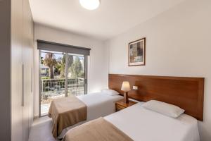 Ένα ή περισσότερα κρεβάτια σε δωμάτιο στο Melissoula Villa +41 φωτογραφίες