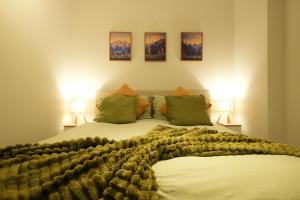 a bedroom with a large bed with two lamps at Modern & Cozy Flat in the Heart of Chelmsford - F7 in Chelmsford