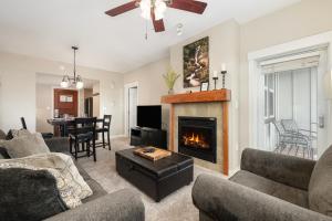 a living room with two couches and a fireplace at Ski-In / Ski-Out 1 Bedroom Condo base of WP Resort in Winter Park