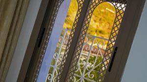 a view through a glass door with a window at Dar Ouadie Serene Blue in Chefchaouen