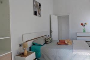 a bedroom with a bed with a headboard at Casa Billota in Torrox +26 photos