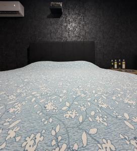 Ένα ή περισσότερα κρεβάτια σε δωμάτιο στο Apartman De Luxe