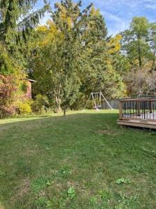 a park with a bench and a playground at V-swim-2 Bed & breakfast in Toronto