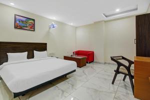 En eller flere senge i et værelse på Hotel O Kinsfolk Inn