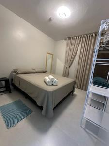 En eller flere senge i et værelse på Apartamento Centro Torres Jose Bonifacio