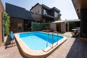 Swimmingpoolen hos eller tæt på Botanical House