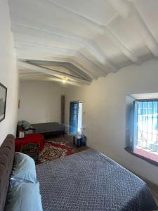 Giường trong phòng chung tại Casona Tres Reyes