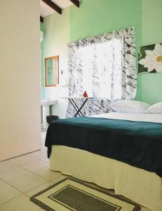 Ένα ή περισσότερα κρεβάτια σε δωμάτιο στο Ocean Heights2