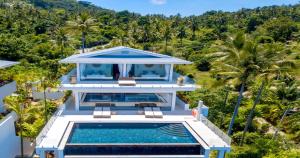 an aerial view of a house with a swimming pool at BLUE BUTTERFLY Luxury Pool Villa Koh Samui 5 Bedrooms in Koh Samui 
