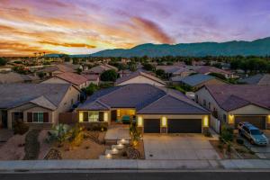 an aerial view of a residential neighborhood with a house at Turquoise Mirage Fun House in Indio
