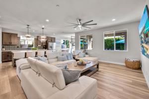 a living room with a couch and a table at Turquoise Mirage Fun House in Indio
