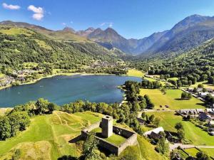 an aerial view of a lake in the mountains at Maison pour 5 à Génos proche lac et station avec WiFi - FR-1-695-94 in Génos