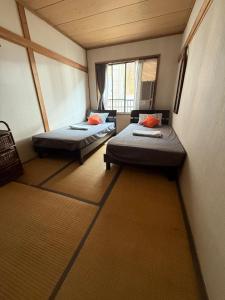 Ένα ή περισσότερα κρεβάτια σε δωμάτιο στο TRAX NUNOBA - Vacation STAY 02612v +32 φωτογραφίες