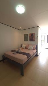 Postel nebo postele na pokoji v ubytování Malaika Residence