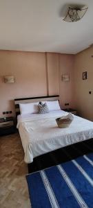 Un pat sau paturi într-o cameră la Les hauts de Taghazout