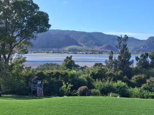 a view of a lake with mountains in the background at Tairua Getaway in Tairua