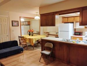 a kitchen and living room with a table and a couch at Golden Sunflower's Apt A in Lawton