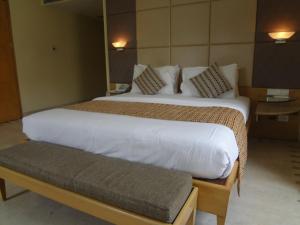 Postel nebo postele na pokoji v ubytování Ascot Hotel