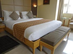 Postel nebo postele na pokoji v ubytování Ascot Hotel