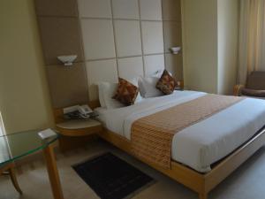 Postel nebo postele na pokoji v ubytování Ascot Hotel