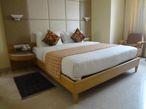 Postel nebo postele na pokoji v ubytování Ascot Hotel