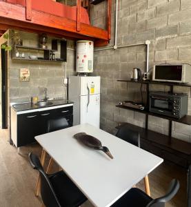 a kitchen with a white table with a spoon on it at Altos de Arenas in Miramar