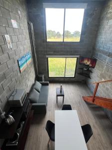 a living room with a couch and a table at Altos de Arenas in Miramar