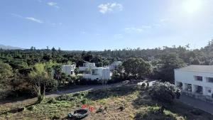 an aerial view of a city with buildings and trees at 제주 신성의 숲 웰니스 호텔 in Haean +47 photos
