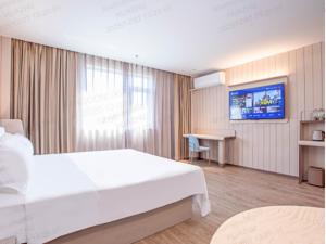 Ένα ή περισσότερα κρεβάτια σε δωμάτιο στο Hanting Hotel Beijing Yizhuang Creative Life Plaza Cultural Park