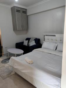 Кровать или кровати в номере Luxe Homes