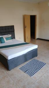 a large bed in a room with at Villa guest house in Ndola