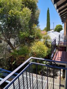 a staircase leading up to a house with a tree at Northwood Bed and Breakfast in Perth