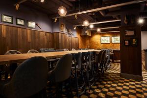 a conference room with a long table and chairs at Boutique Hotel Spedition a member of DESIGN HOTELS in Thun