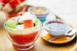a glass cup filled with fruit and vegetables on a table at Villino Eleonora in Parghelia