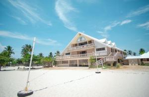 a large building on the beach with at Santa Fe Beach Club in Ocoy
