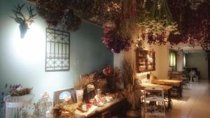 a room with a table with decorations on the wall at Kite Hostel in Chiayi City