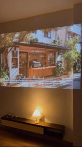 a tv screen with a picture of a house at Solia Villa in Da Nang