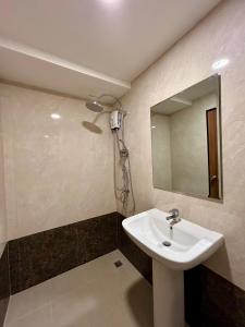 a bathroom with a sink and a mirror at Hillside-Seashore Space Mai Khao Beach in Mai Khao Beach +2 photos