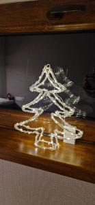 a metal object on top of a wooden table at Domek na Folwarku z jacuzzi in Tarnawa Dolna