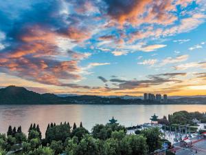 a view of a river with a cloudy sky at Lavande Hotels·Yichang Wanda Plaza in Yichang