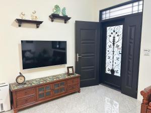 TV a/nebo společenská místnost v ubytování 瑪麗殿民宿