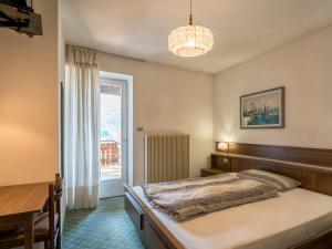 A bed or beds in a room at Albergo Panorama