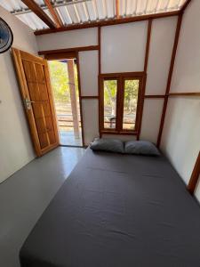 Ένα ή περισσότερα κρεβάτια σε δωμάτιο στο Modo homestay