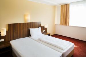 Rúm í herbergi á Hahn Hotel Vienna